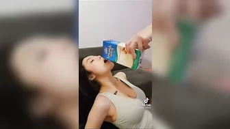 Busty woman drinking nut milk #2