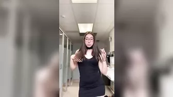 teen shaking ass in school bathroom